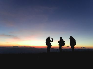 silhoutte of three people