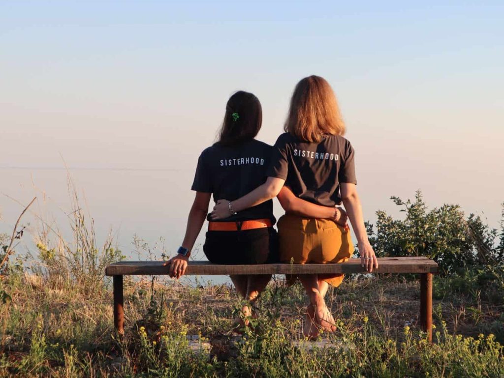 sisters sitting on a bench