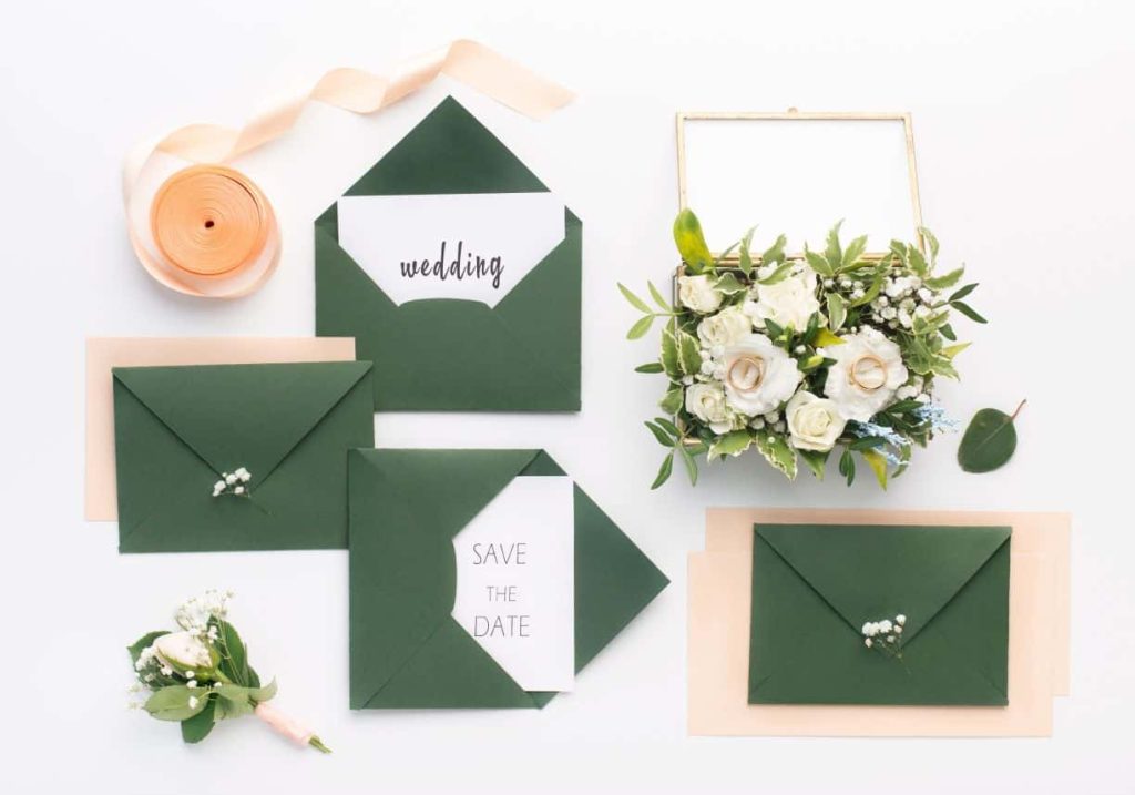 wedding invitations on green envelop