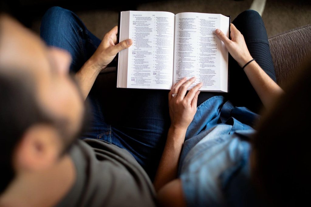 couple holding a bible