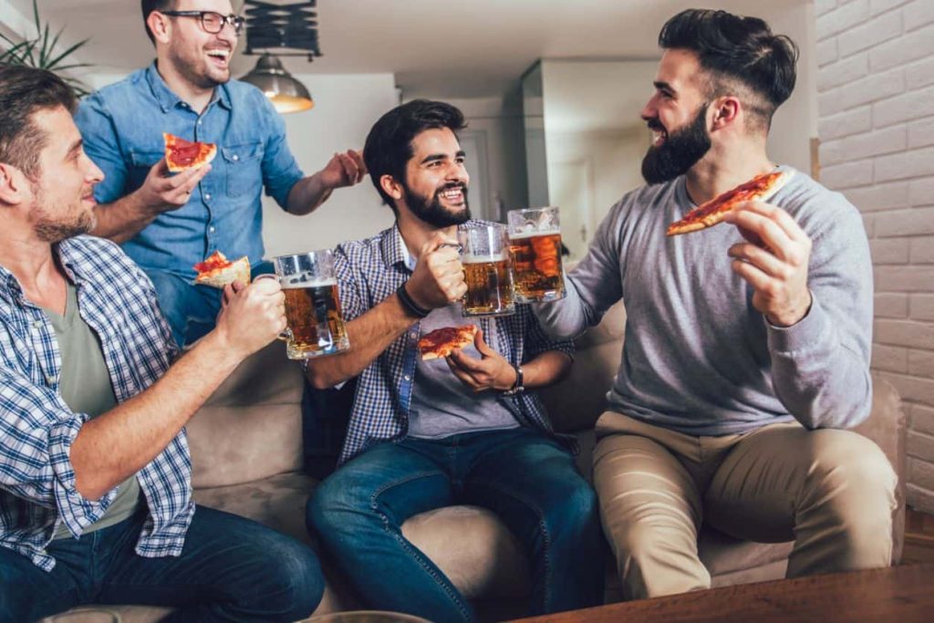 men eating pizza and drinking-beer