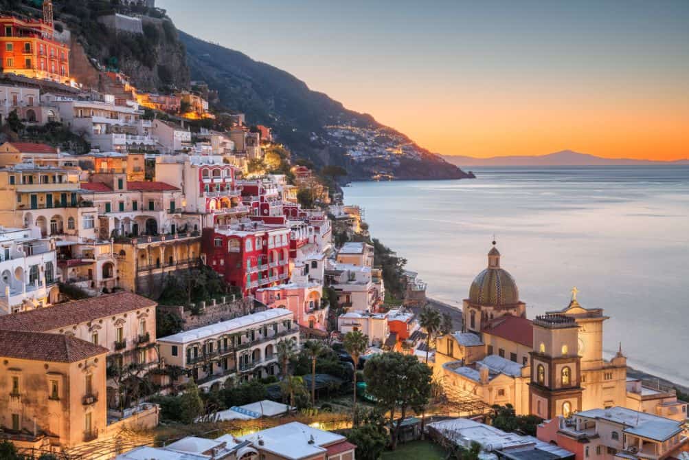 birds eye view of positano along the amalfi coast during sunset