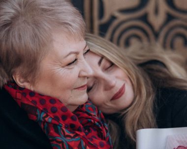 woman lying on her aunt's shoulder
