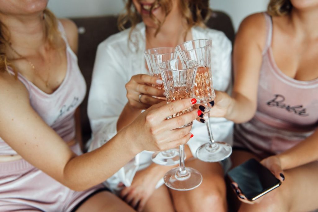 women clinking champagne flutes