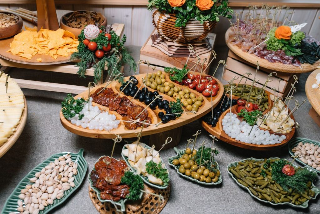 antipasto boards offering a wide array of fruits, vegetables, nuts, meats, and appetizers