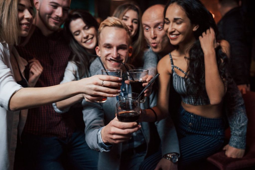 group of friends toasting with glasses of beer