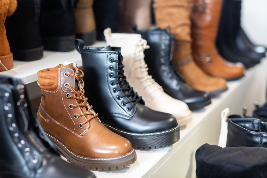 various styles of boots displayed on shop window