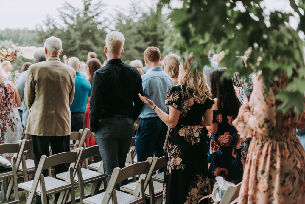 wedding guests wearing semi-formal and formal attire