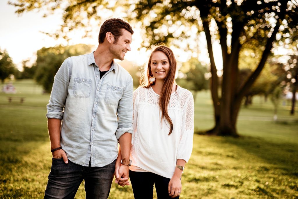 couple holding hands and smiling for a photo