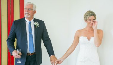 Emotional bride with father during wedding celebratio