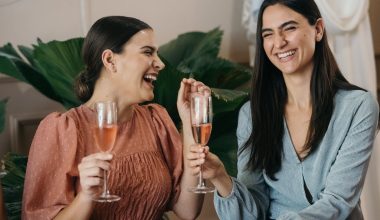 Two Women Having Fun while Drinking a Rosé