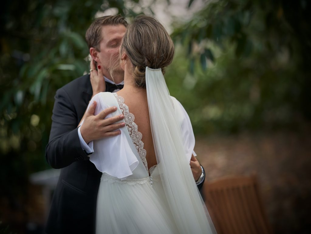 couple kissing at their wedding