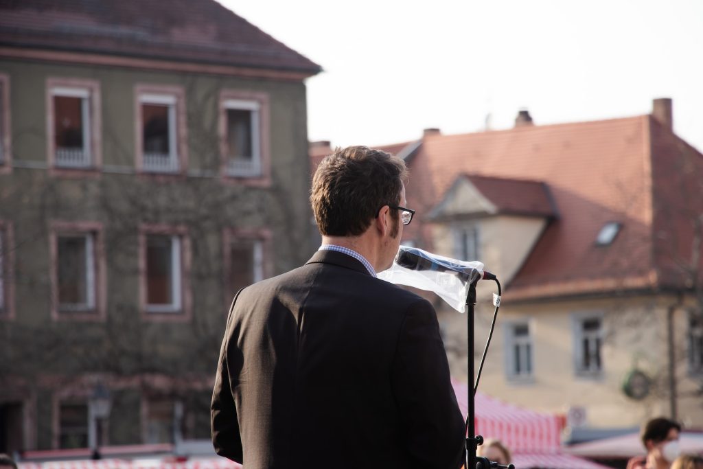 man giving a speech outdoors